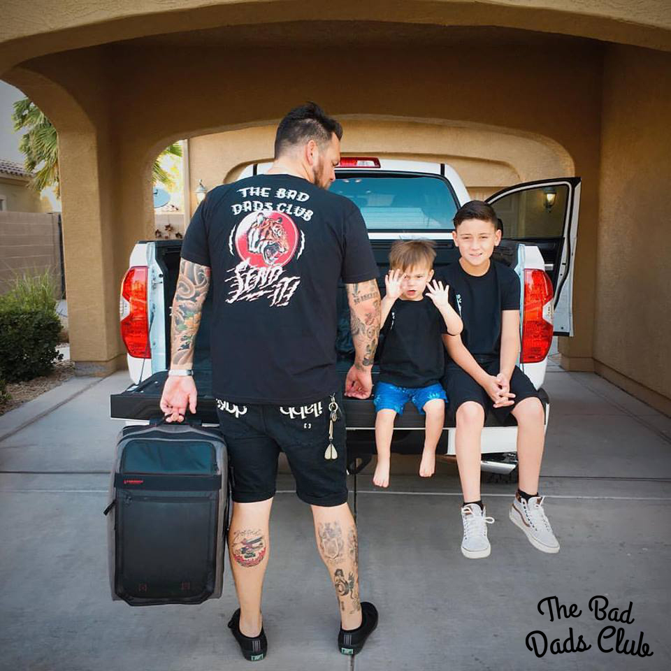 image of a dad and his boys getting ready for a road trip