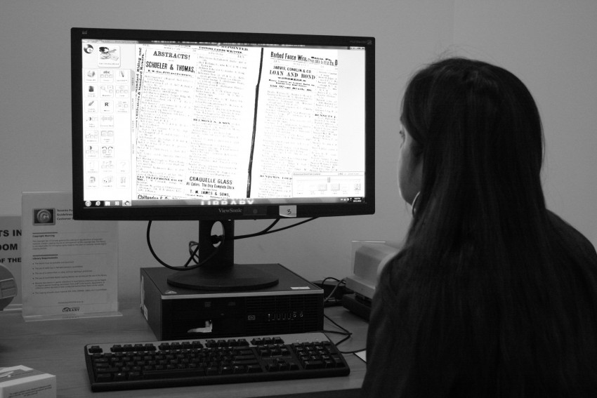 Image of Upper Canada Geneaology's Janice Nickerson reviewing microfilm