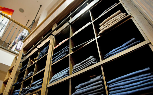 image of a wall of denim at the coop
