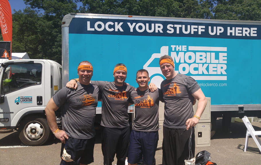 image of tough mudders using the mobile locker company facilities