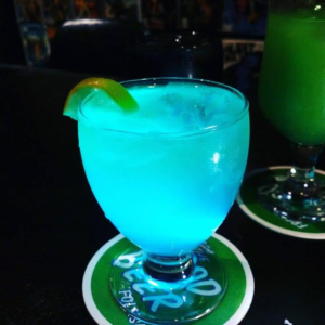 image of a glowing blue drink at see-scape